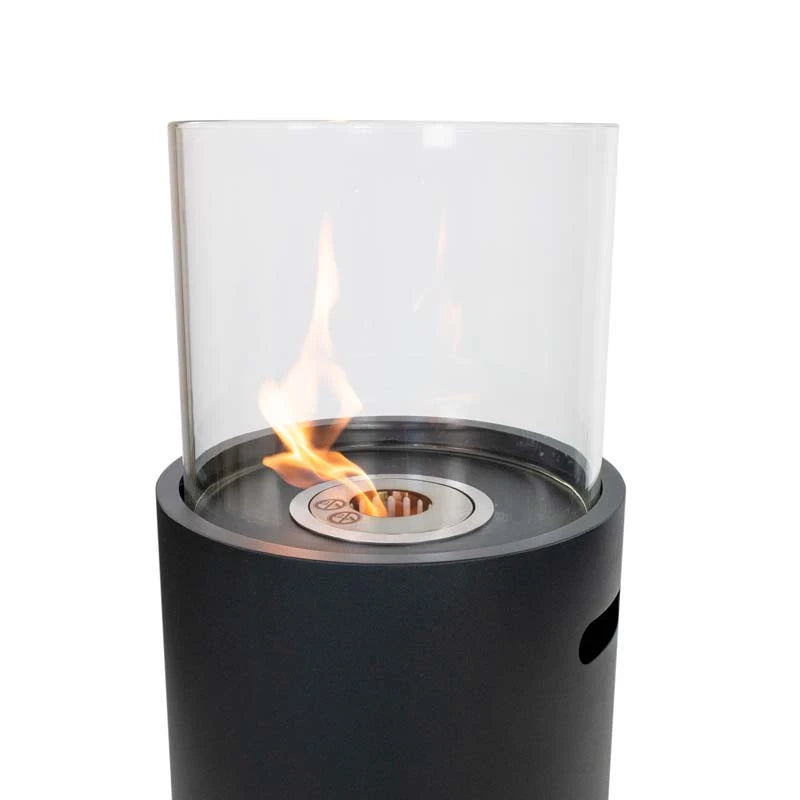 Close-up of the lit flame inside the ScandiFlames outdoor black bioethanol fireplace's glass cylinder