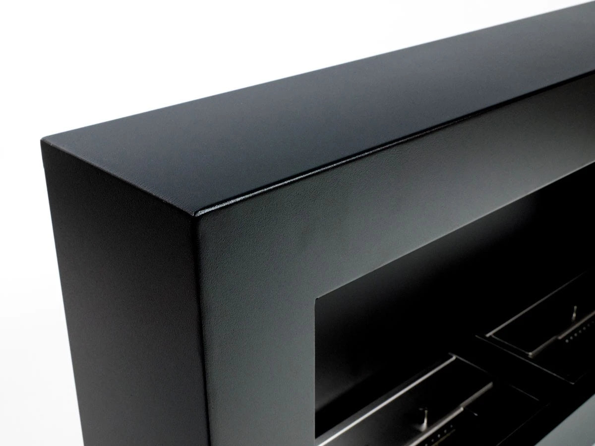 Close-up of the large black bio fireplace's corner and powder-coated finish