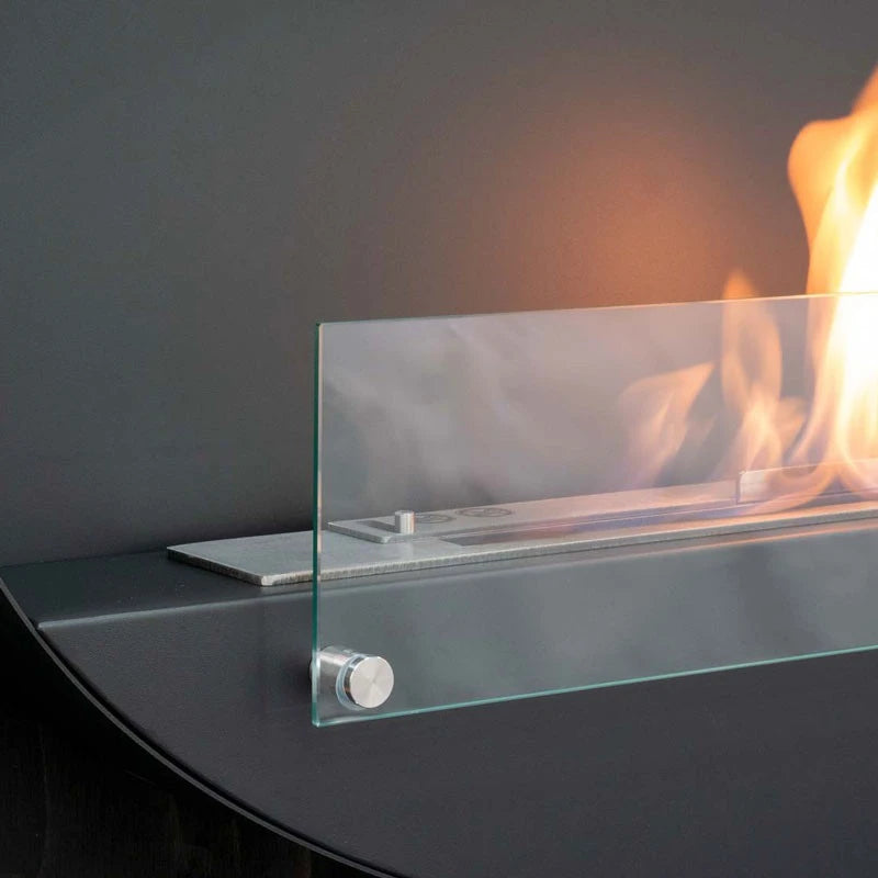 Close-up of the Maryland bio fireplace's glass burner tray, lit with a realistic flame