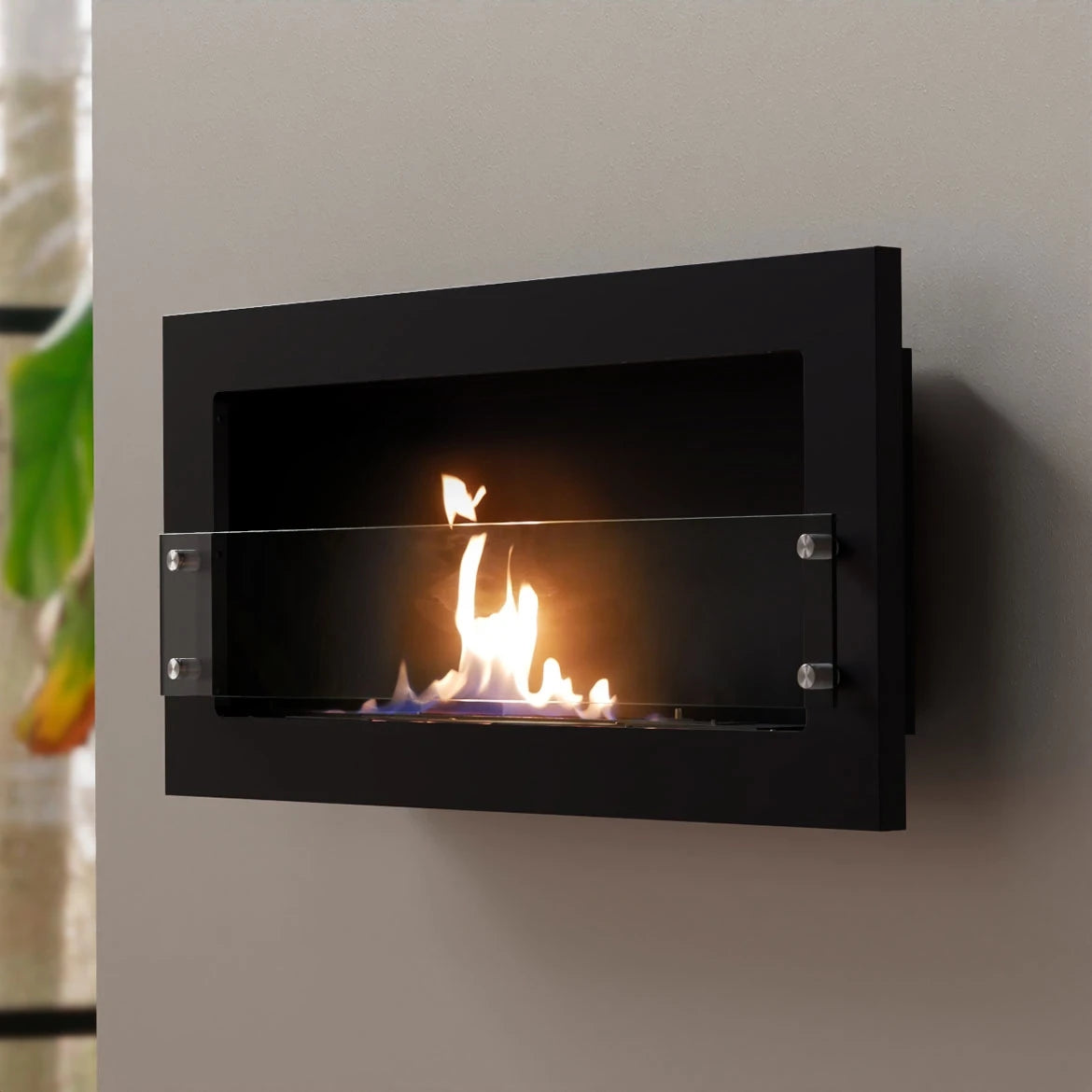 Texas black bioethanol fireplace mounted on a grey styled wall, angled view with a lit flame