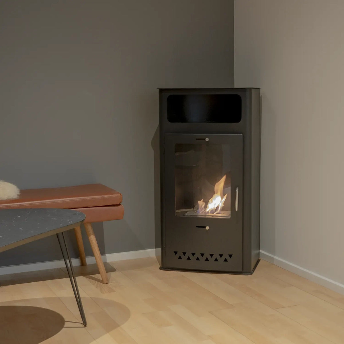 Boston black bioethanol stove lit in a rendered living room corner setting