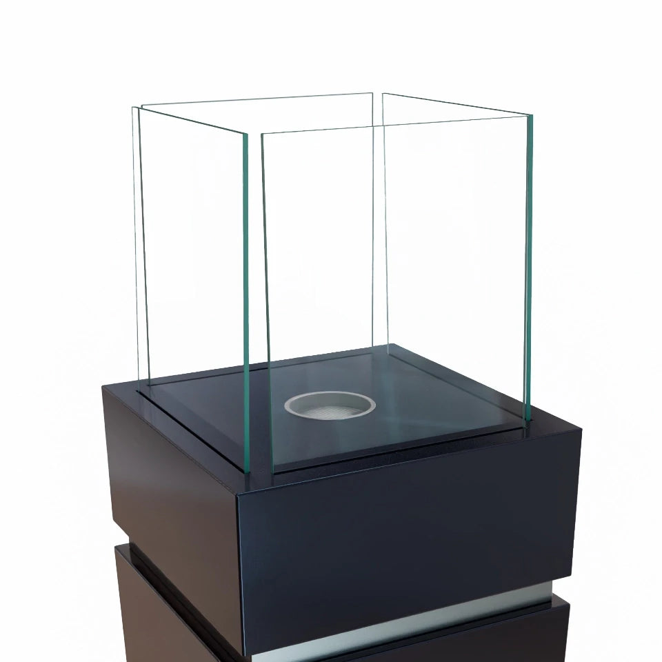 Elegant black bioethanol fireplace, unlit, close-up of the glass top studio shot