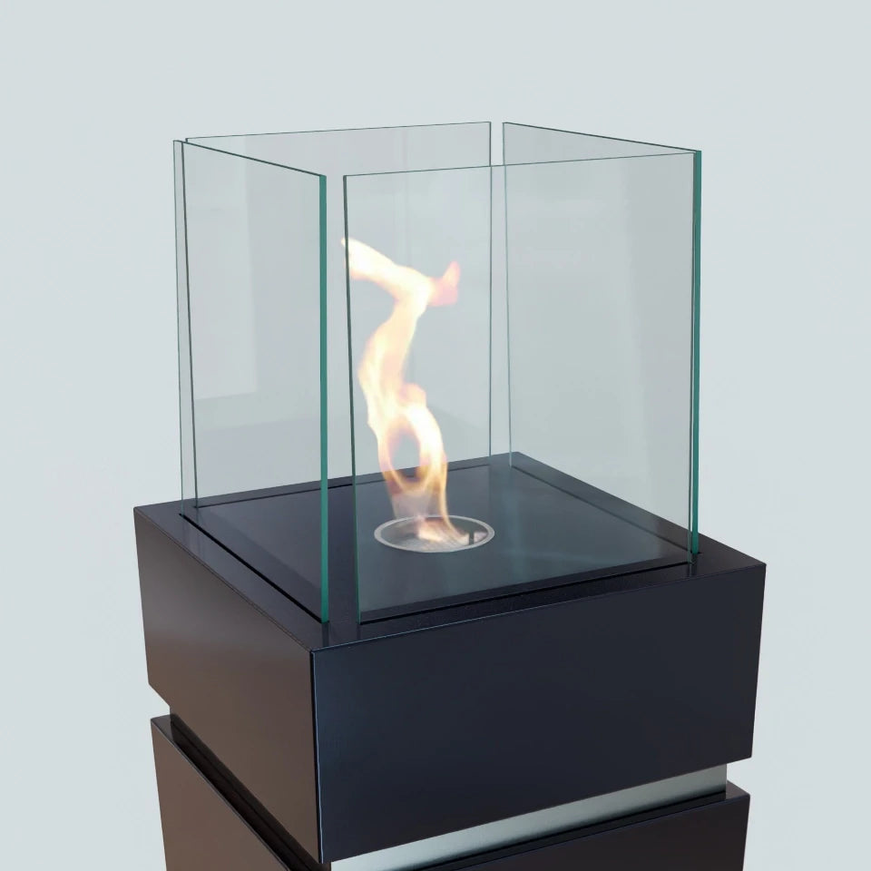 Elegant black bioethanol fireplace with lit flame, close-up studio shot