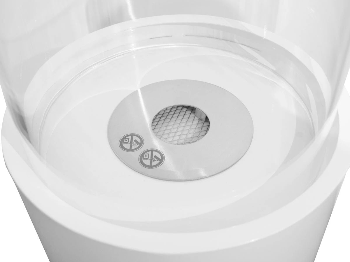 Outdoor white bioethanol fireplace, unlit, top-down view of the burner