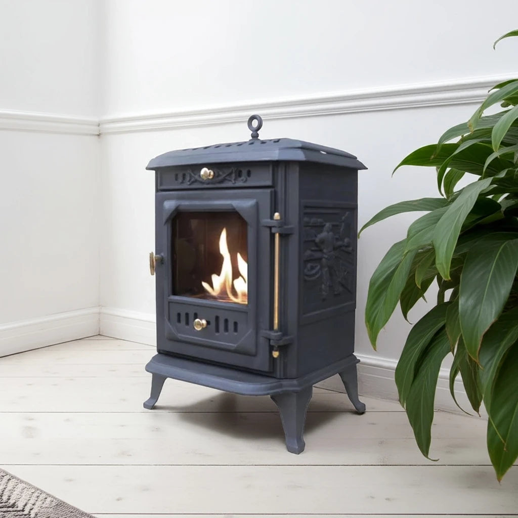 ScandiFlames Ulvik cast iron bioethanol stove styled in a real living room with wood floor and plant, lit real flame