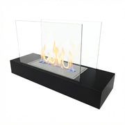 Oklahoma black steel bioethanol fireplace with a lit flame, white studio background