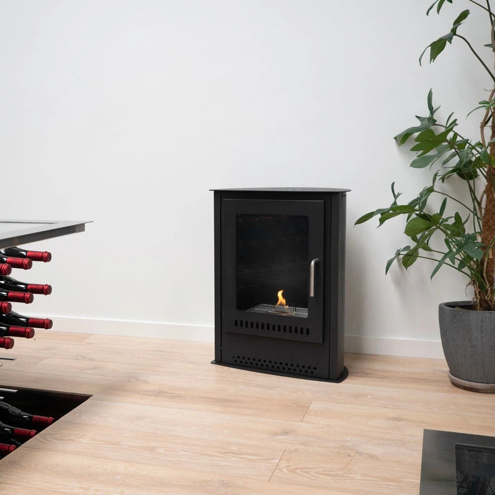 Carson small bioethanol stove fireplace, lit flame, kitchen with wine rack and plant