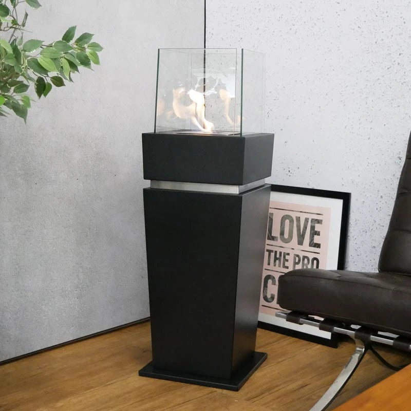 Elegant black bioethanol fireplace lit in a showroom setting, different angle