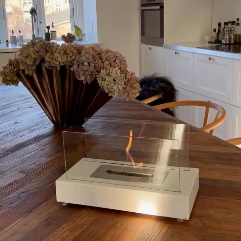 Lambeth white bioethanol fireplace, unlit, showing the glass side panels and construction