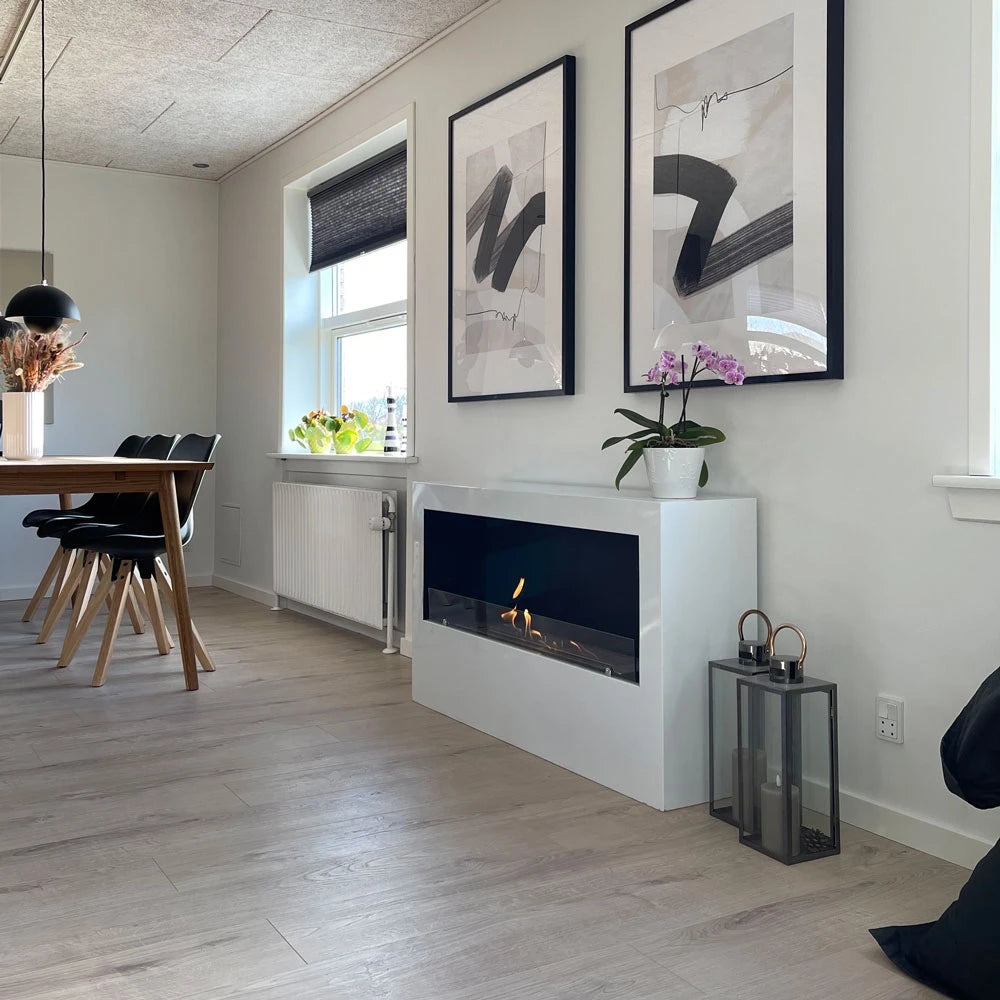 ScandiFlames Bismarck white bioethanol fireplace lit in a kitchen-dining living space