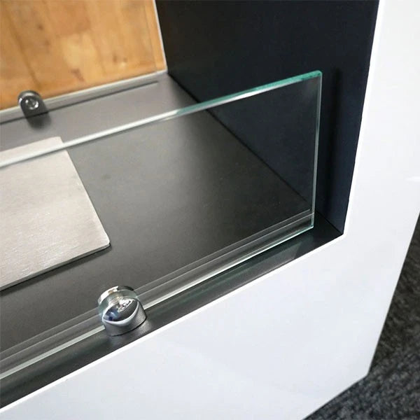 Close-up of the glass mounting bracket on the Lansing XL white bioethanol fireplace