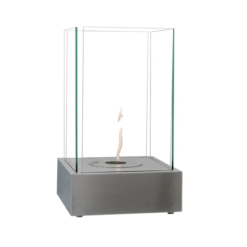 Hydro steel bioethanol fireplace with lit spiral flame, angled studio view