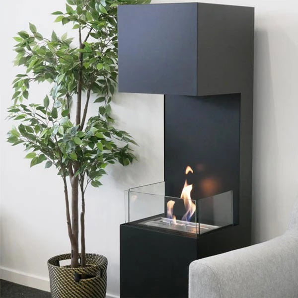Open 3-Sided black bioethanol fireplace lit in a living room beside a potted tree