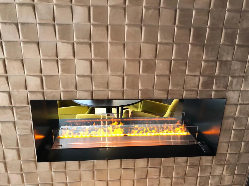Foco Myst Two 1000 built into a room divider wall, lit flame, lifestyle photo