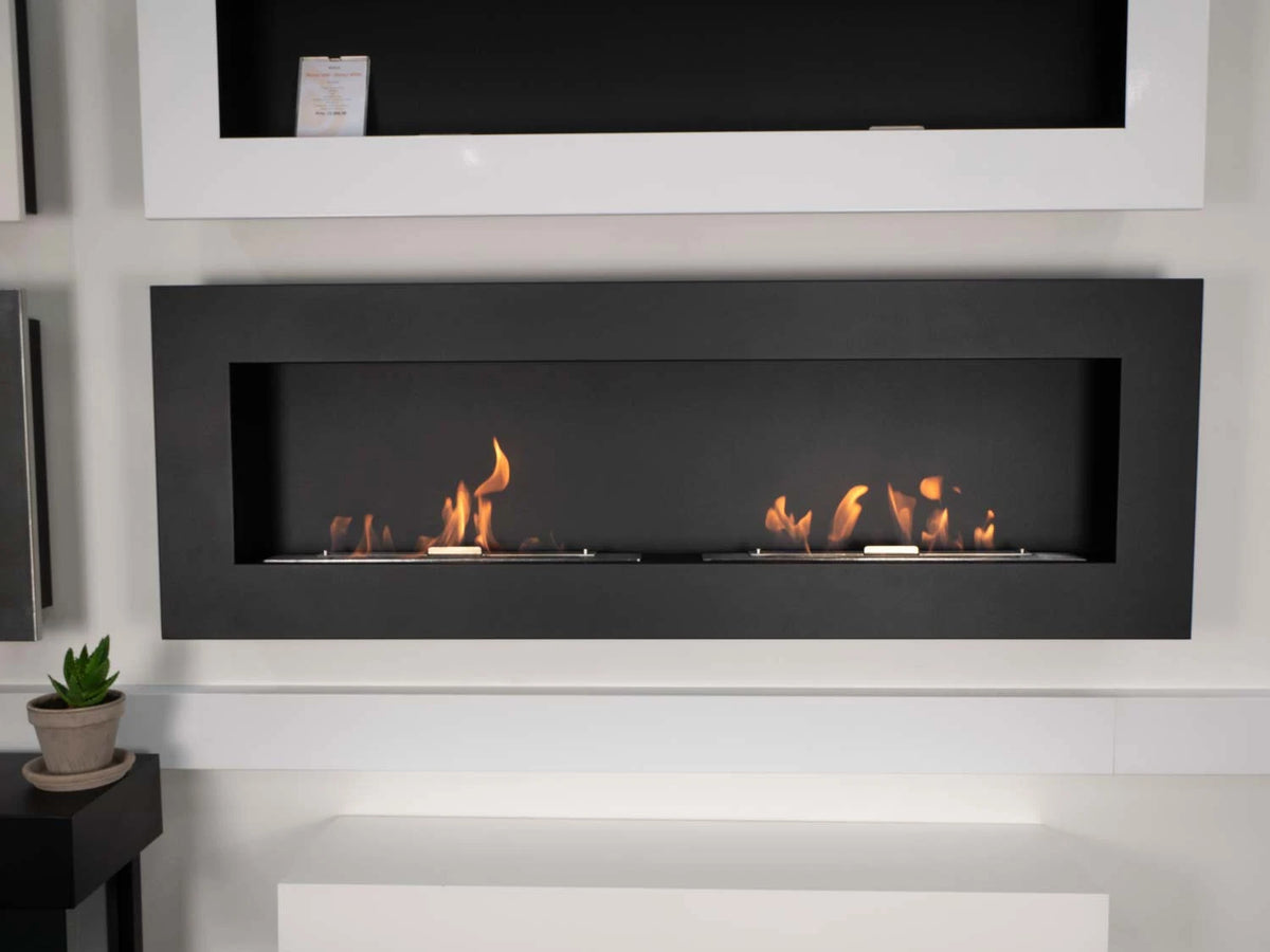 Murus fireplaces displayed in a showroom setting, black model shown lit below a white model