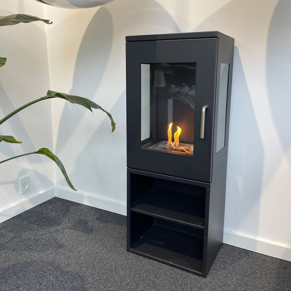 Cheyenne bioethanol stove fireplace in a room corner, lit flame, showing the 3-sided glass view