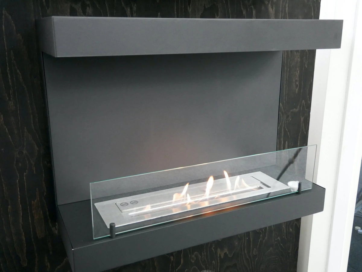 Close-up of the Dakota black three-sided bio fireplace's glass panel and burner tray, lit